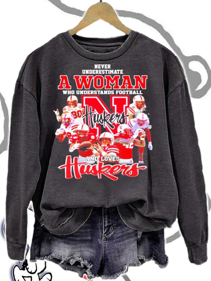 Huskers never underestimate a woman who understands football and love shirt